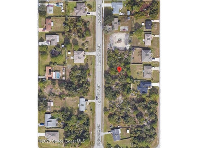 This attractive Palm Bay property at 607 De Groodt Rd SW offers - photo 1