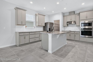 Welcome to this stunning lakefront split plan home in The - photo 4