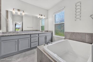 Welcome to this stunning lakefront split plan home in The - photo 9