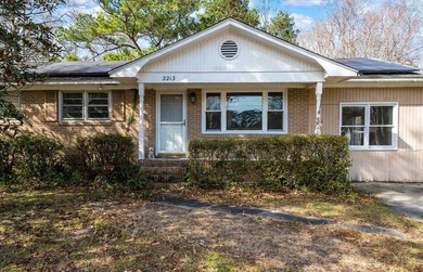 Welcome home to this well-cared-for brick beauty in the heart of - photo 3