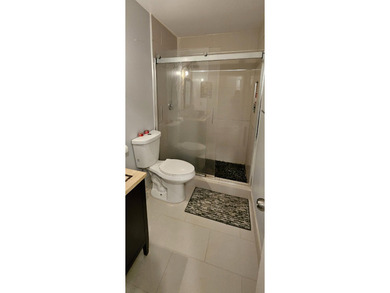 Welcome to this charming two-bedroom, two-bathroom villa in the - photo 15
