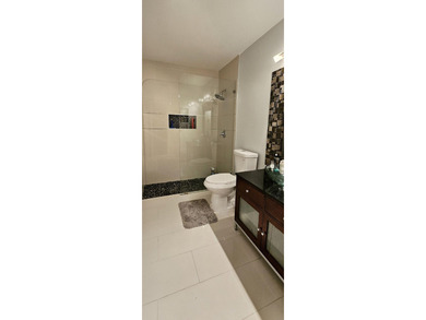 Welcome to this charming two-bedroom, two-bathroom villa in the - photo 16