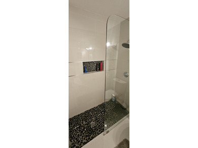 Welcome to this charming two-bedroom, two-bathroom villa in the - photo 17