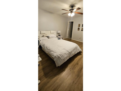 Welcome to this charming two-bedroom, two-bathroom villa in the - photo 19