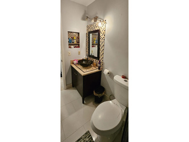 Welcome to this charming two-bedroom, two-bathroom villa in the - photo 24