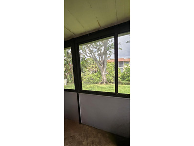 Welcome to this charming two-bedroom, two-bathroom villa in the - photo 29