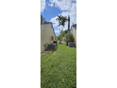 Welcome to this charming two-bedroom, two-bathroom villa in the - photo 30