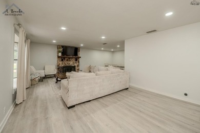 This spacious 4-bedroom, 2-bathroom home offers a warm and - photo 3