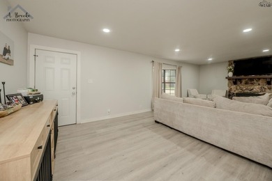 This spacious 4-bedroom, 2-bathroom home offers a warm and - photo 4
