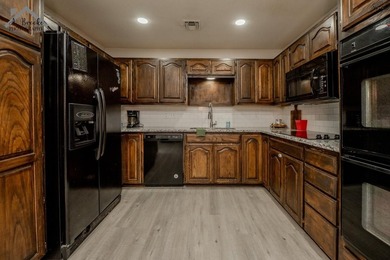 This spacious 4-bedroom, 2-bathroom home offers a warm and - photo 6