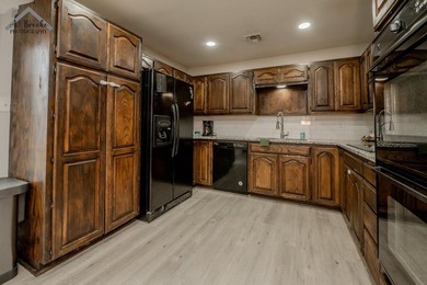 This spacious 4-bedroom, 2-bathroom home offers a warm and - photo 7