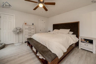 This spacious 4-bedroom, 2-bathroom home offers a warm and - photo 9
