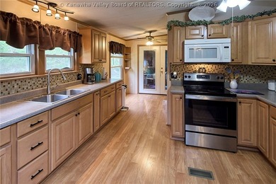 Situated on two acres in rural Milton, this 1996 double-wide - photo 10