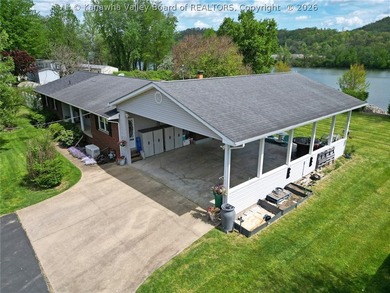 Welcome to riverfront living at its finest, where luxury - photo 6