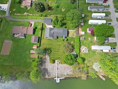 Welcome to riverfront living at its finest, where luxury - photo 9