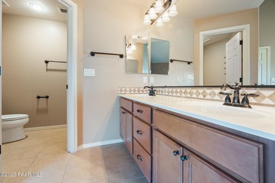 Tucked within the gated, pine-lined community of The Villages II