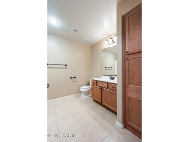 Tucked within the gated, pine-lined community of The Villages II