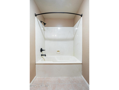 Tucked within the gated, pine-lined community of The Villages II