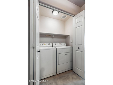 Tucked within the gated, pine-lined community of The Villages II