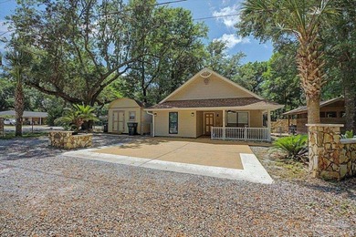 Charming 3-bedroom, 2-bath home tucked beneath a canopy of - photo 2
