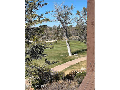 Tucked within the gated, pine-lined community of The Villages II