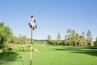 Tucked within the gated, pine-lined community of The Villages II