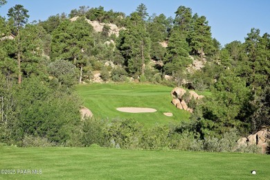 Tucked within the gated, pine-lined community of The Villages II