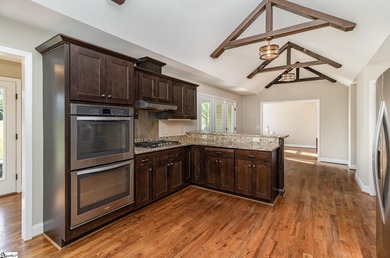 Located in the sought-after Smithfields golf community, this