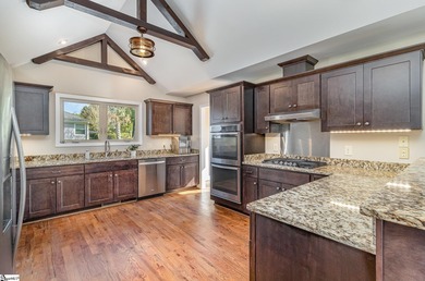 Located in the sought-after Smithfields golf community, this