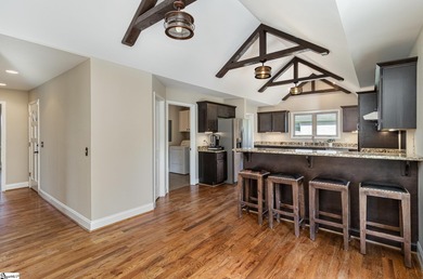 Located in the sought-after Smithfields golf community, this