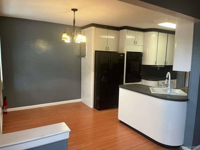 Well-maintained Legal 2- Family Brick House now available in the - photo 3