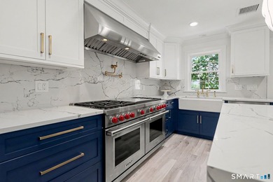 Fully remodeled with top-of-the-line finishes throughout, this - photo 8