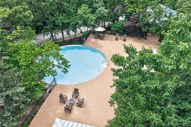 Surrounded by mature trees and natural Ozarks beauty, this - photo 7