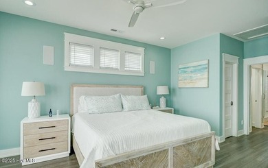 Nestled along a pristine stretch of coastline, this stunning