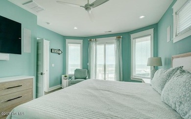 Nestled along a pristine stretch of coastline, this stunning