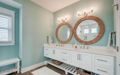 Nestled along a pristine stretch of coastline, this stunning