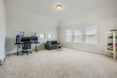 This like new, barely lived in smart home, features an open - photo 25