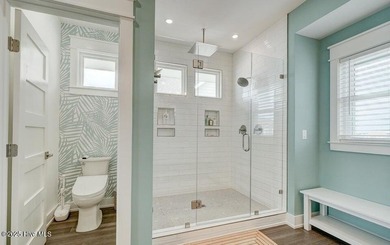 Nestled along a pristine stretch of coastline, this stunning