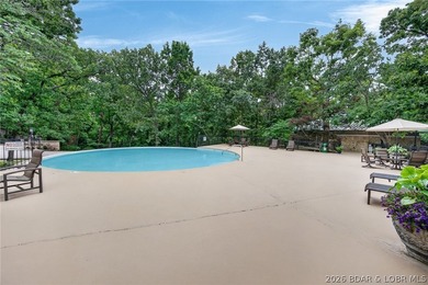 Surrounded by mature trees and natural Ozarks beauty, this - photo 8