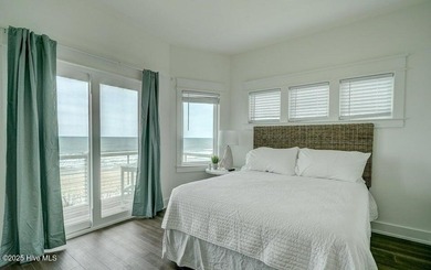 Nestled along a pristine stretch of coastline, this stunning