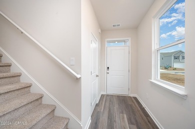 Welcome to Indigo Preserve! The 3 car garage Wren floorplan - photo 3