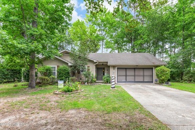 Welcome to this well-maintained 3-bedroom, 2-bath home situated - photo 1