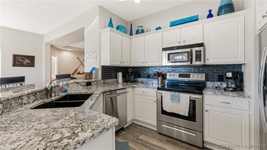 Enjoy incredible lake views from this spacious 4-bedroom, 3-bath