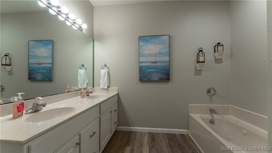 Enjoy incredible lake views from this spacious 4-bedroom, 3-bath