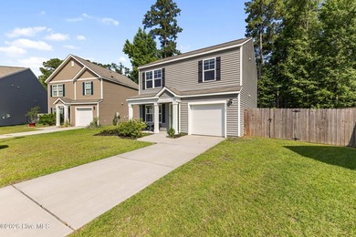 Welcome to 9363 Vineyard Grove Lane NE in Vineyard Grove! Built - photo 3