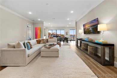 Experience refined lake living in this walk-in level, end-unit