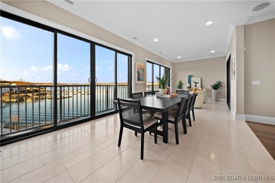 Experience refined lake living in this walk-in level, end-unit