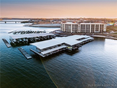 Experience refined lake living in this walk-in level, end-unit