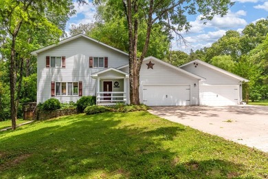 Tucked away on a peaceful one-acre wooded lot, this 4-bedroom, 3 - photo 1