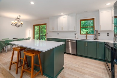 Tucked away on a peaceful one-acre wooded lot, this 4-bedroom, 3 - photo 7